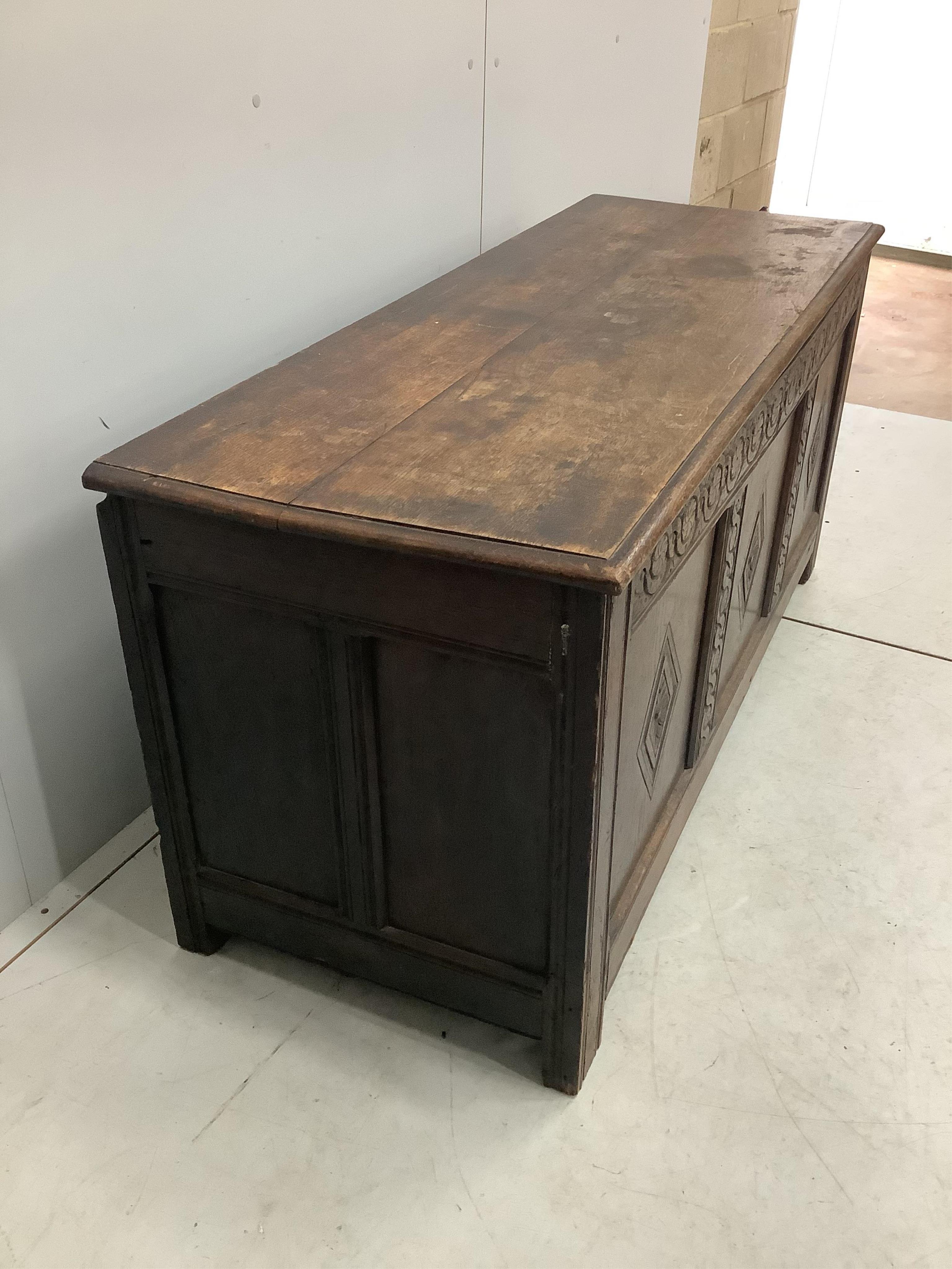 An 18th century carved oak coffer, width 141cm, depth 53cm, height 68cm. Condition - fair